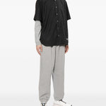 Camicia con logo ricamato in nero COMME DES GARCONS HOMME - uomo 