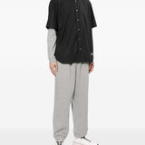 Camicia con logo ricamato in nero COMME DES GARCONS HOMME - uomo 