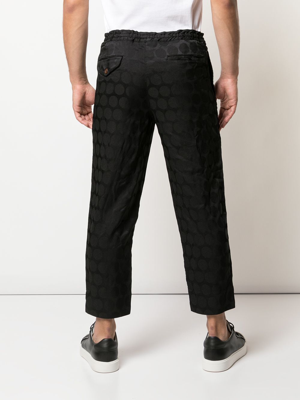 Pantaloni con trama geometrica in nero Comme des Garçons Homme Plus - uomo 