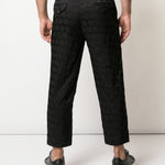 Pantaloni con trama geometrica in nero Comme des Garçons Homme Plus - uomo 