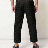 Pantaloni con trama geometrica in nero Comme des Garçons Homme Plus - uomo 