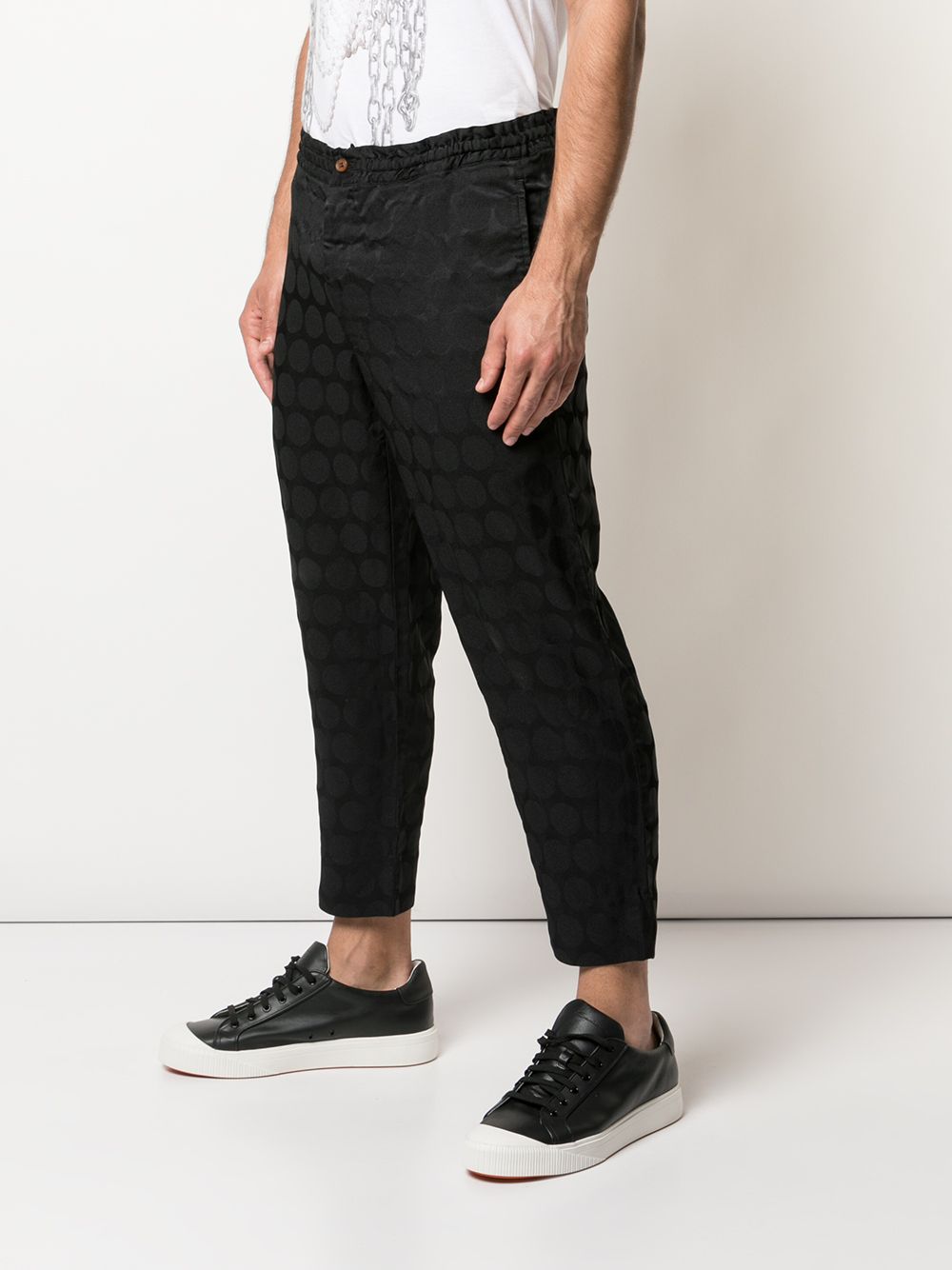 Pantaloni con trama geometrica in nero Comme des Garçons Homme Plus - uomo 
