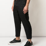Pantaloni con trama geometrica in nero Comme des Garçons Homme Plus - uomo 