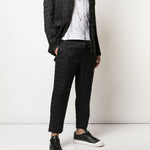 Pantaloni con trama geometrica in nero Comme des Garçons Homme Plus - uomo 