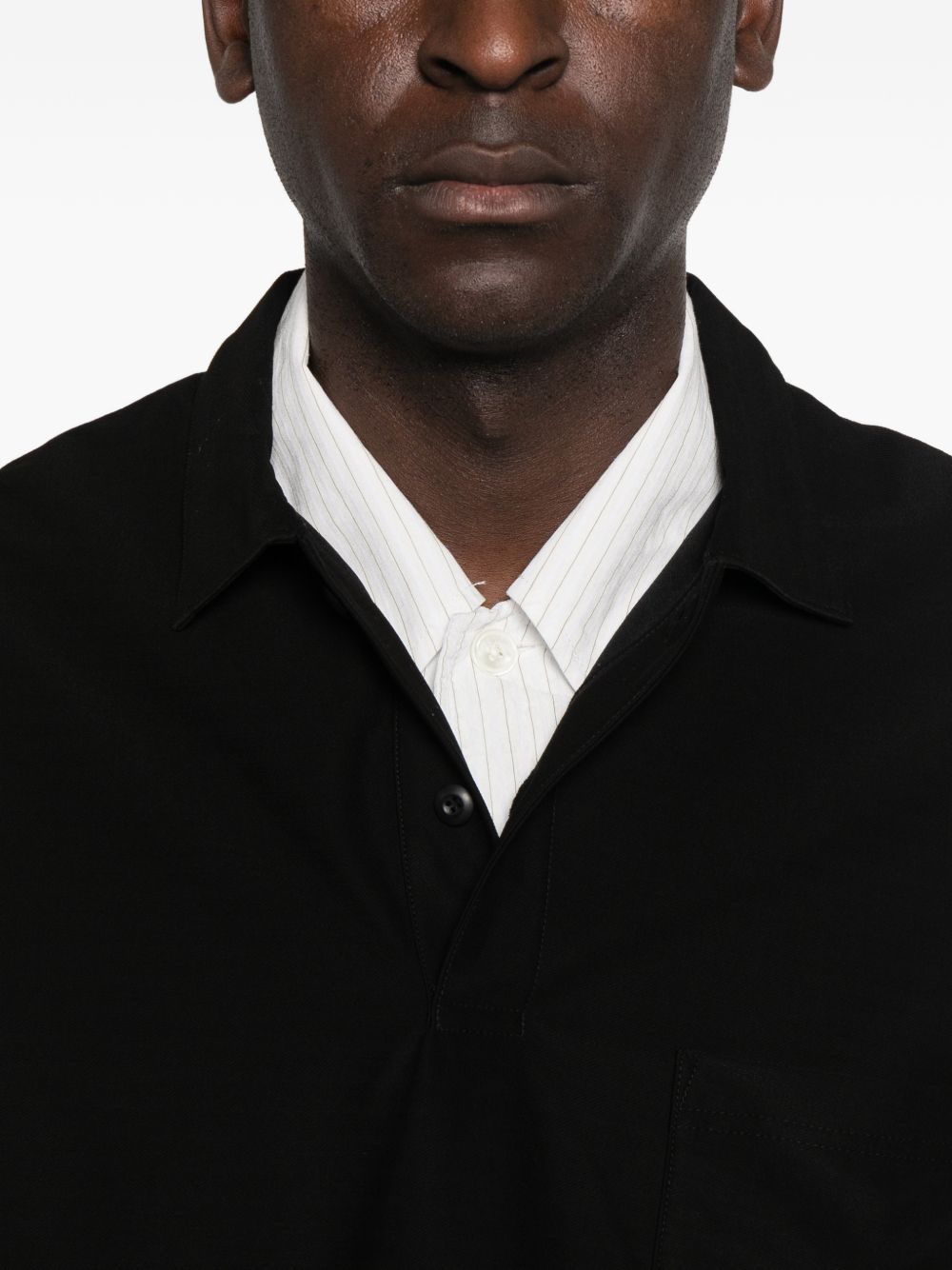 Polo con orlo elasticizzato in nero Comme des garcons homme - uomo 
