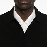 Polo con orlo elasticizzato in nero Comme des garcons homme - uomo 
