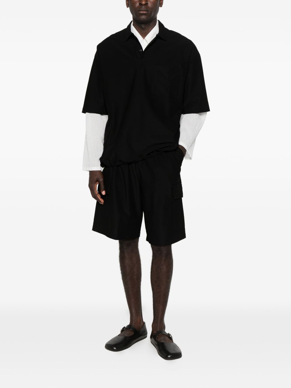 Polo con orlo elasticizzato in nero Comme des garcons homme - uomo 