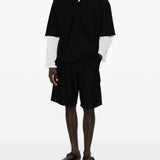 Polo con orlo elasticizzato in nero Comme des garcons homme - uomo 