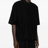 Polo con orlo elasticizzato in nero Comme des garcons homme - uomo 