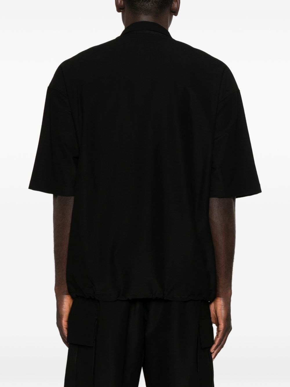 Polo con orlo elasticizzato in nero Comme des garcons homme - uomo 