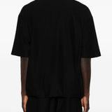 Polo con orlo elasticizzato in nero Comme des garcons homme - uomo 