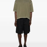 T-shirt con cuciture a contrasto in verde Comme des garcons homme - uomo 