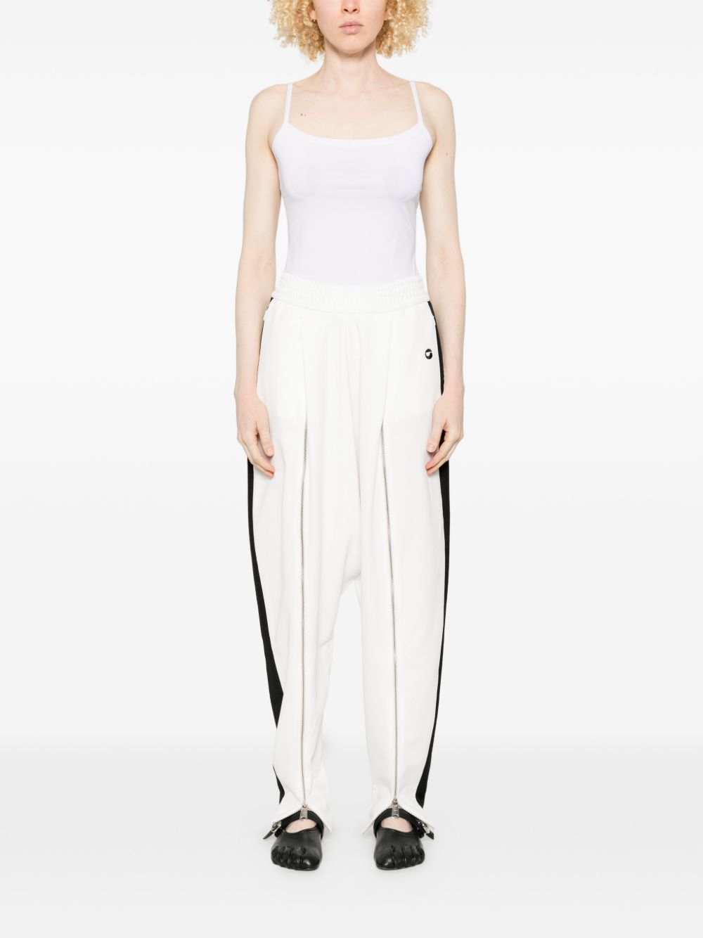 Pantaloni con zip in bianco Coperni - donna 