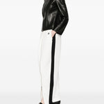 Pantaloni con zip in bianco Coperni - donna 