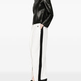 Pantaloni con zip in bianco Coperni - donna 