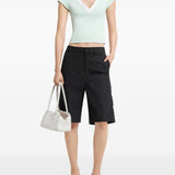 Polo con scollo a V in verde Courrèges - donna 