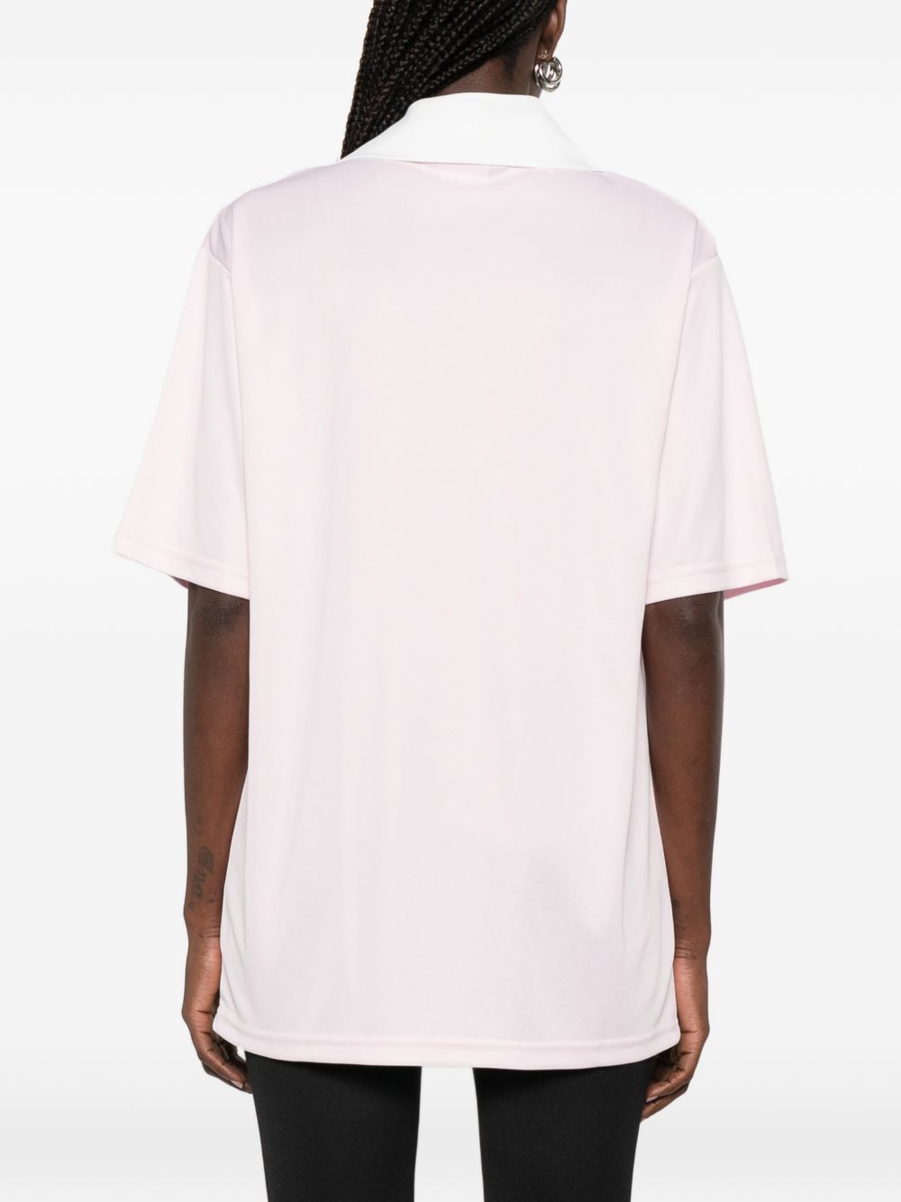 Polo con logo e ricamo a v in bianco Courrèges - donna 