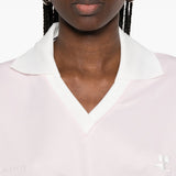 Polo con logo e ricamo a v in bianco Courrèges - donna 