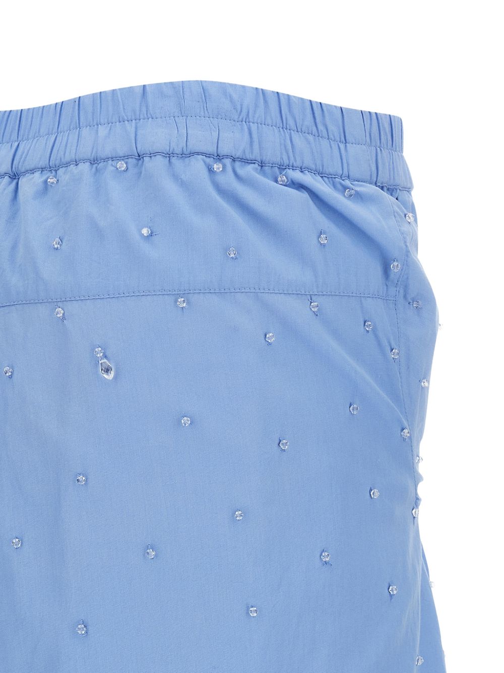 Pantaloni con applicazioni di cristalli in blu 