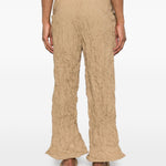 Pantaloni plissettati in beige gongdid design - donna 