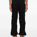 Pantaloni a gamba ampia in nero Gongdid design - uomo 