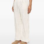 Pantaloni con vita elasticizzata in bianco Gongdid design - uomo 