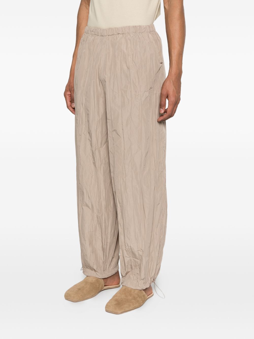 Pantaloni con vita elasticizzata in beige Gongdid design - uomo 