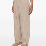 Pantaloni con vita elasticizzata in beige Gongdid design - uomo 