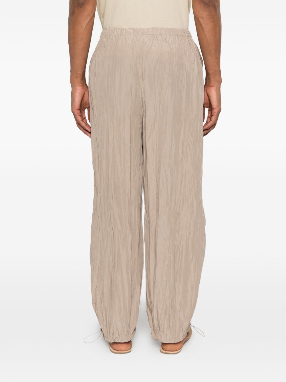 Pantaloni con vita elasticizzata in beige Gongdid design - uomo 