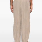 Pantaloni con vita elasticizzata in beige Gongdid design - uomo 