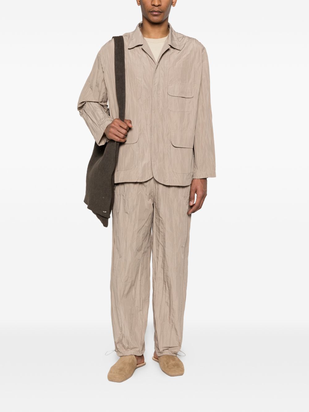 Pantaloni con vita elasticizzata in beige Gongdid design - uomo 