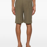 Pantaloncini elasticizzati con pieghe in verde Gongdid design - uomo 