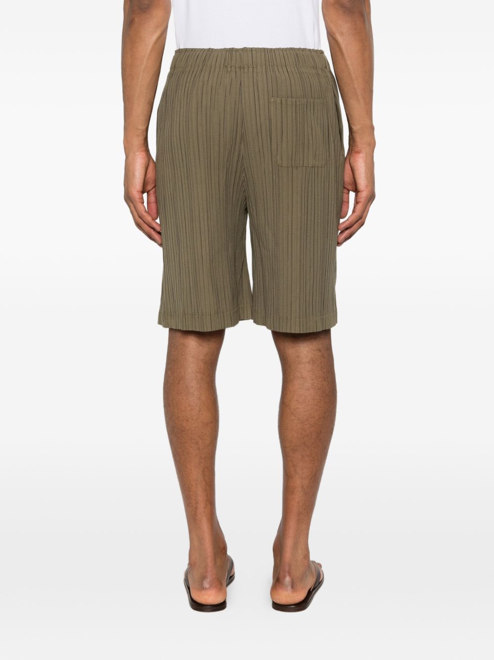 Pantaloncini elasticizzati con pieghe in verde Gongdid design - uomo 