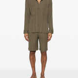 Pantaloncini elasticizzati con pieghe in verde Gongdid design - uomo 