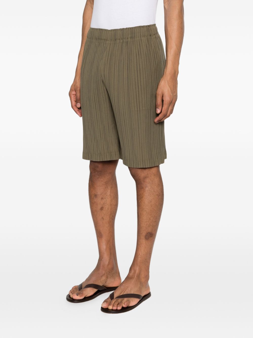 Pantaloncini elasticizzati con pieghe in verde Gongdid design - uomo 