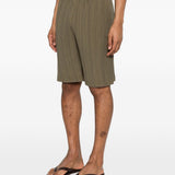 Pantaloncini elasticizzati con pieghe in verde Gongdid design - uomo 