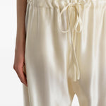 Pantaloni Rohen satinati in avorio Khaite - donna 