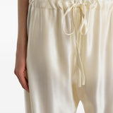 Pantaloni Rohen satinati in avorio Khaite - donna 