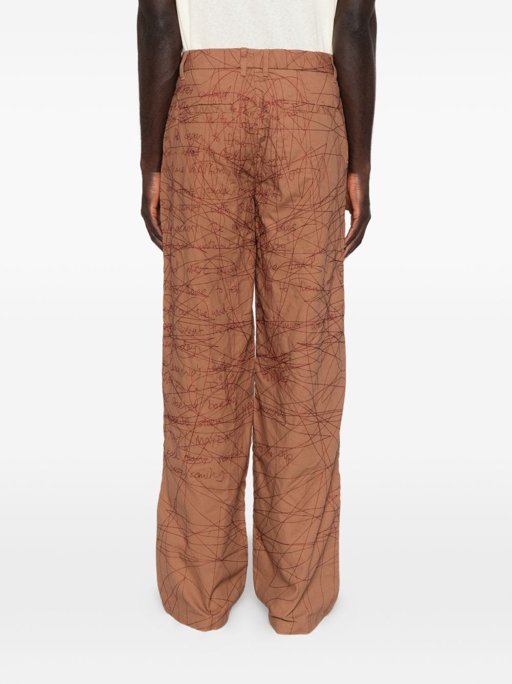 Pantaloni con motivo ricamato in marrone 