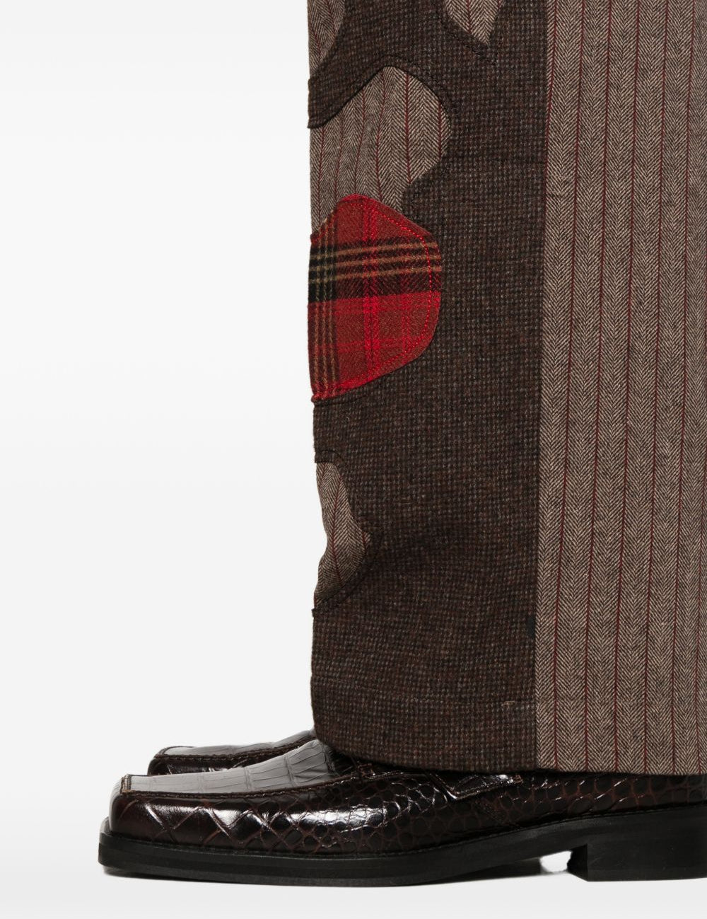 Pantaloni a righe con design patchwork  in marrone Kidsuper - uomo 