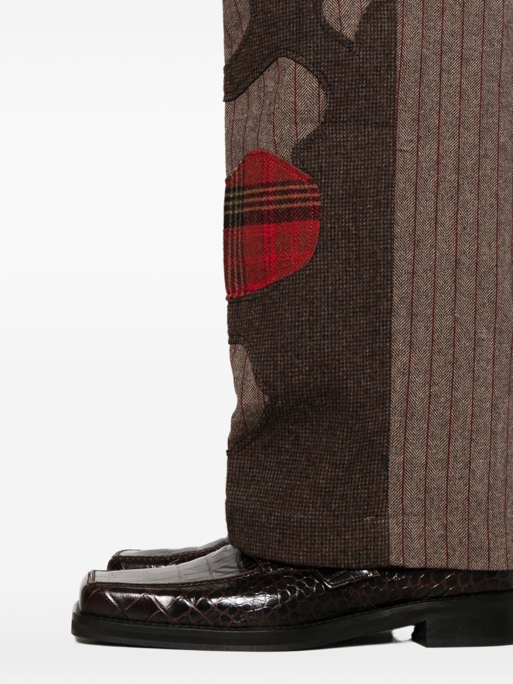 Pantaloni a righe con design patchwork  in marrone Kidsuper - uomo 
