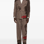 Pantaloni a righe con design patchwork  in marrone Kidsuper - uomo 