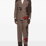 Pantaloni a righe con design patchwork  in marrone Kidsuper - uomo 
