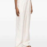 Pantaloni Alera con vita elasticizzata in beige Loulou de saison - donna 
