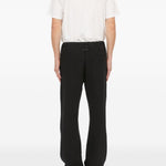 Pantaloni con applicazione in nero Mm6 maison margiela - uomo 