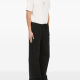 Pantaloni con applicazione in nero Mm6 maison margiela - uomo 