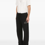 Pantaloni con applicazione in nero Mm6 maison margiela - uomo 