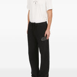 Pantaloni con applicazione in nero Mm6 maison margiela - uomo 