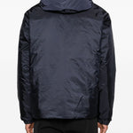 Piumino con cappuccio e logo in blu Moncler - uomo 