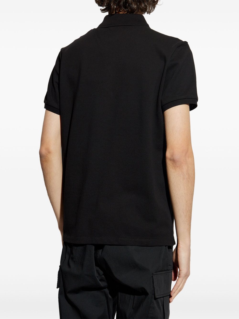 Polo con applicazione logo in nero Moncler - uomo 